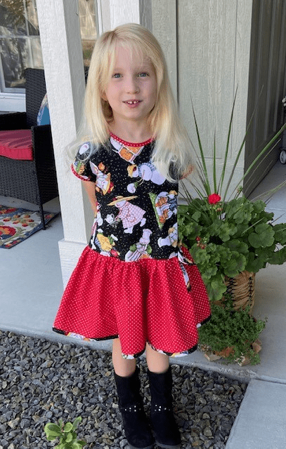 Kid Wearing Olivia Holiday Romper
