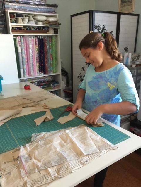Girl Cutting Fabric